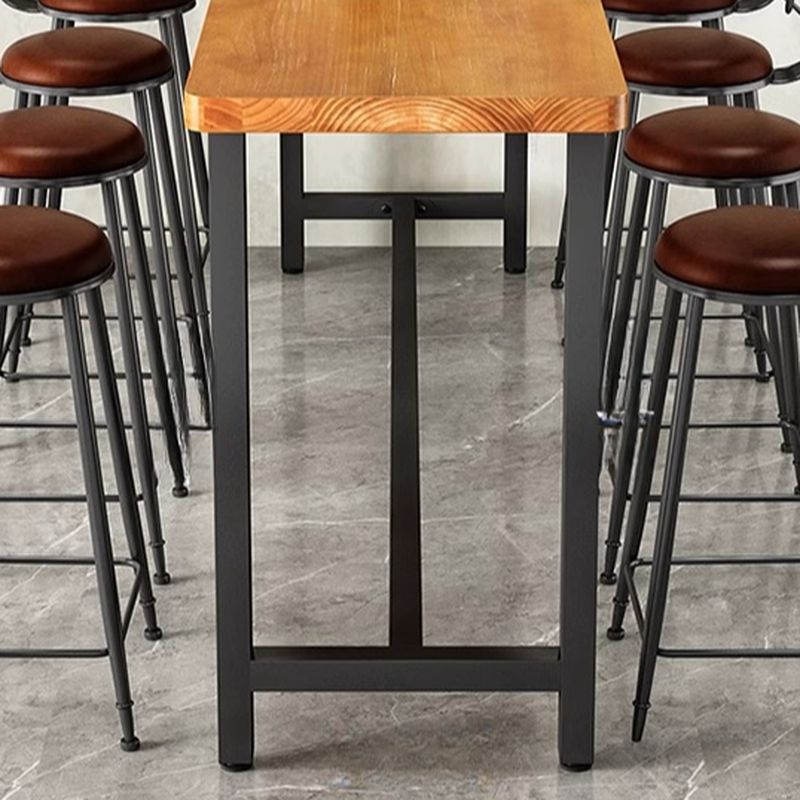 Minimalist Pub Table with Natural Wood Trestle Base in Auburn Rectangle and Foot Pedestal
