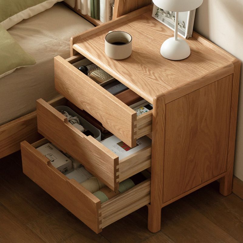 Victorian Nightstand With Drawer Organization Featuring Natural Wood Countertop