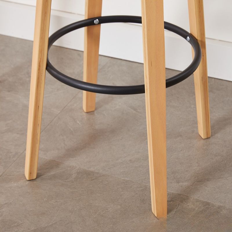 Casual Rawhide Bar Stools in Light Gray/Cream/Amber Color with Back, Turned Swivel, Round Top, and Leg Rest