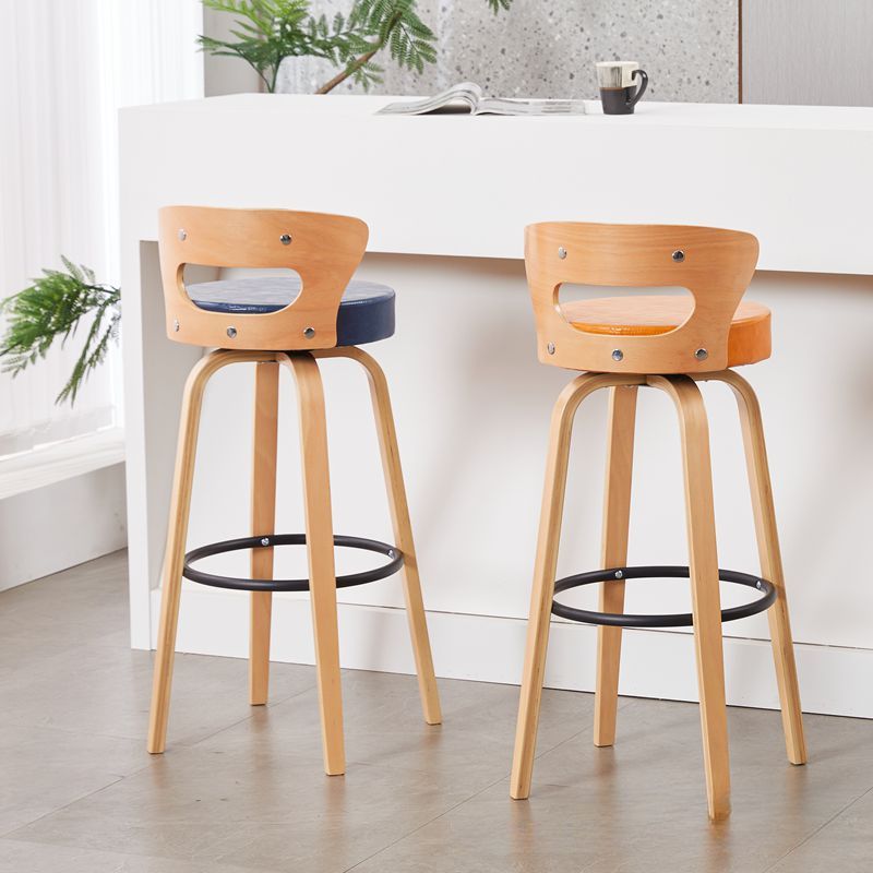 Casual Rawhide Bar Stools in Light Gray/Cream/Amber Color with Back, Turned Swivel, Round Top, and Leg Rest