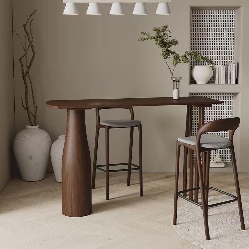 Coffee Wood/Natural Asymmetrical High Top Table in Natural Pine Wood with Three Legs and Upholstered Chair