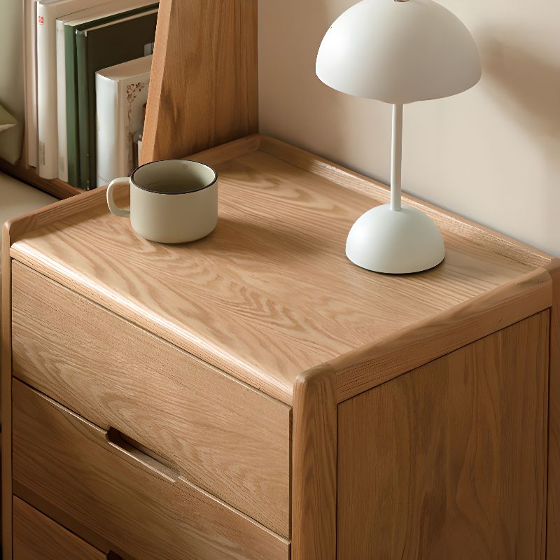 Victorian Nightstand With Drawer Organization Featuring Natural Wood Countertop