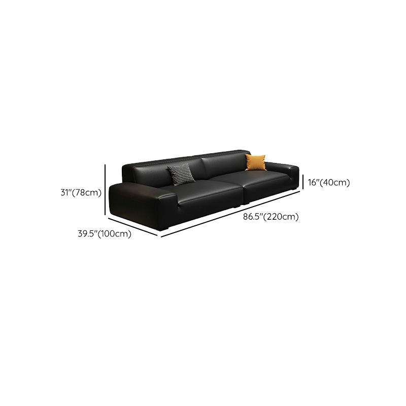 Extra Long Black Leather Sofa with Stain Resistant Feature and Two Pillows