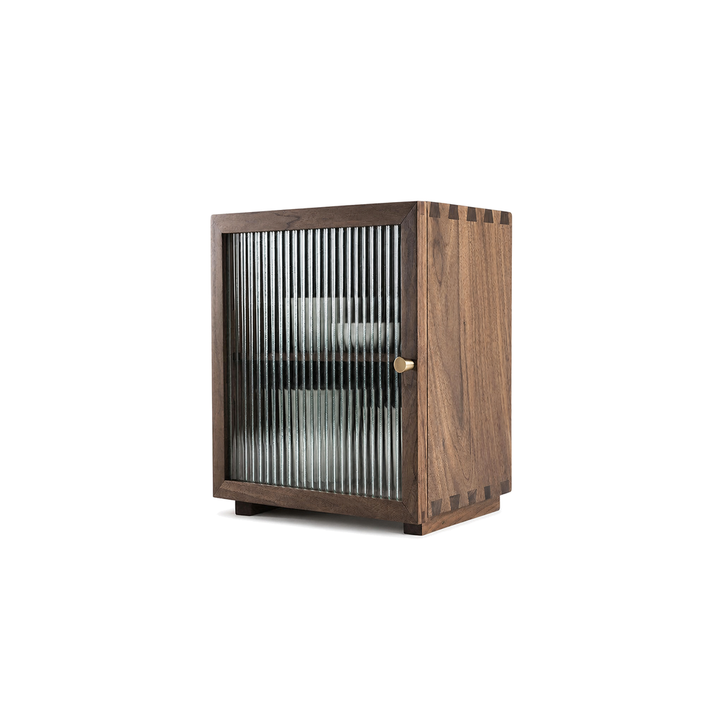 Agni walnut storage cabinet with fluted glass door on white background
