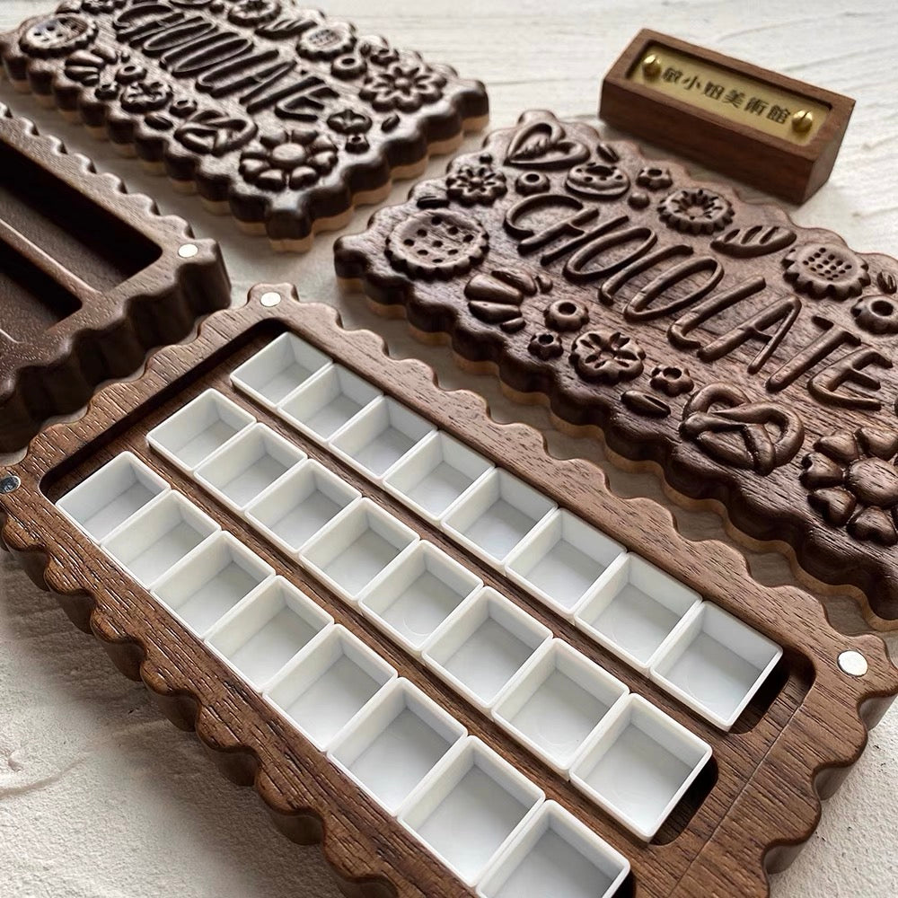 Open Cokkie walnut watercolor palette with 24 pans