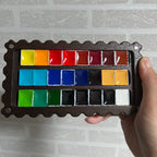 Cokkie palette holding watercolor paints
