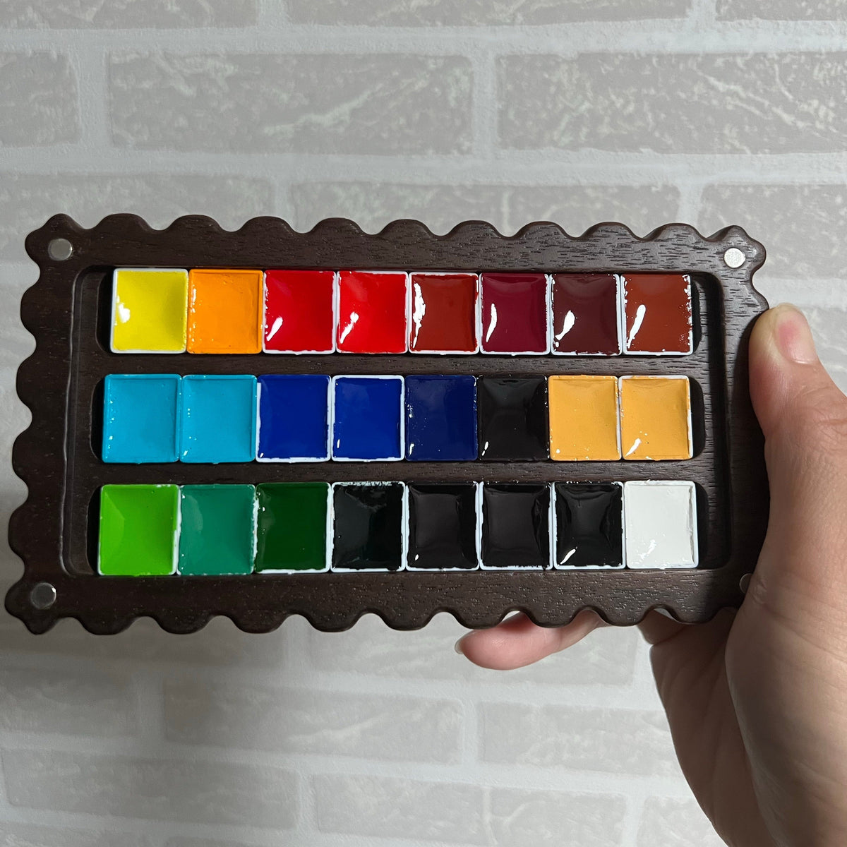 Cokkie palette holding watercolor paints