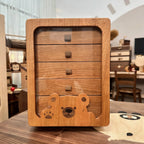 Front view of the Peoria cherry jewelry cabinet with bear-shaped panel