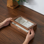 Hands closing the Giselle glass lid