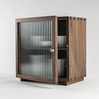 Agni walnut cabinet with fluted glass door three-quarter view