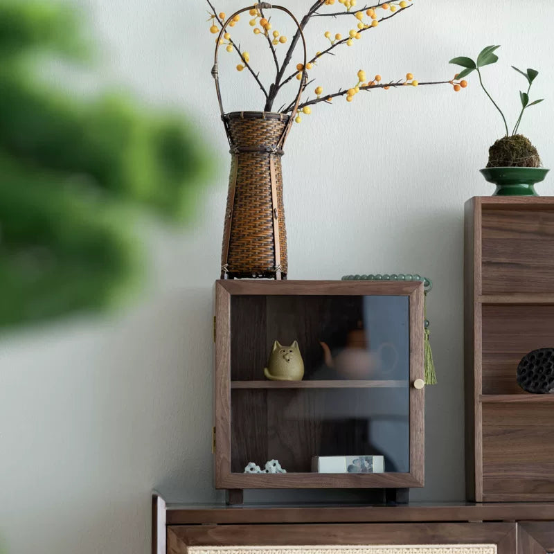 Agni walnut cabinet with clear glass door showing two interior shelves