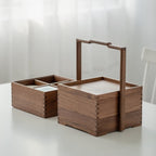 Clef tiered walnut storage caddies on a tabletop