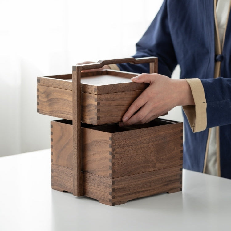 Clef black walnut storage caddy held by its handle