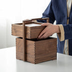 Clef black walnut storage caddy held by its handle