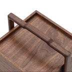 Close-up of the Clef walnut carry handle and joinery