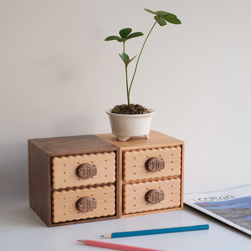 Walnut and cherry Oudine cabinets with plants