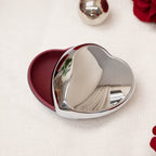 Heart-shaped storage box with red interior and polished lid