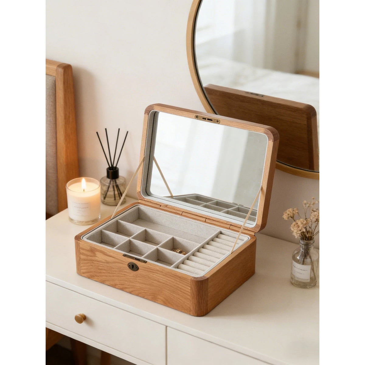 Oak jewelry box displayed open on a dresser