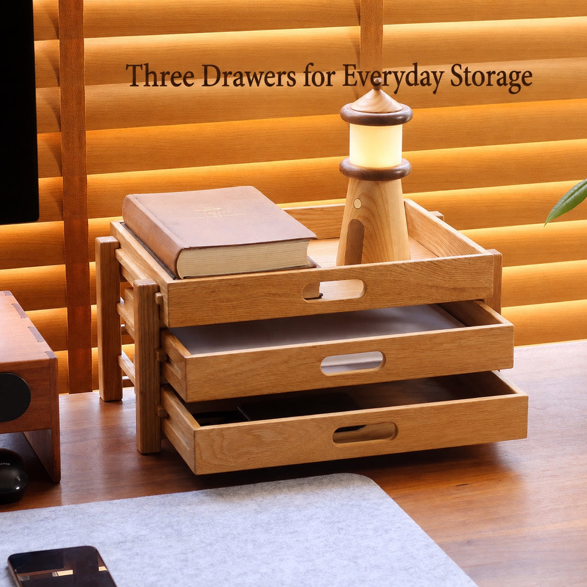 Three pull-out drawers in a desktop organizer