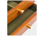 Close-up of round pulls and lined drawers