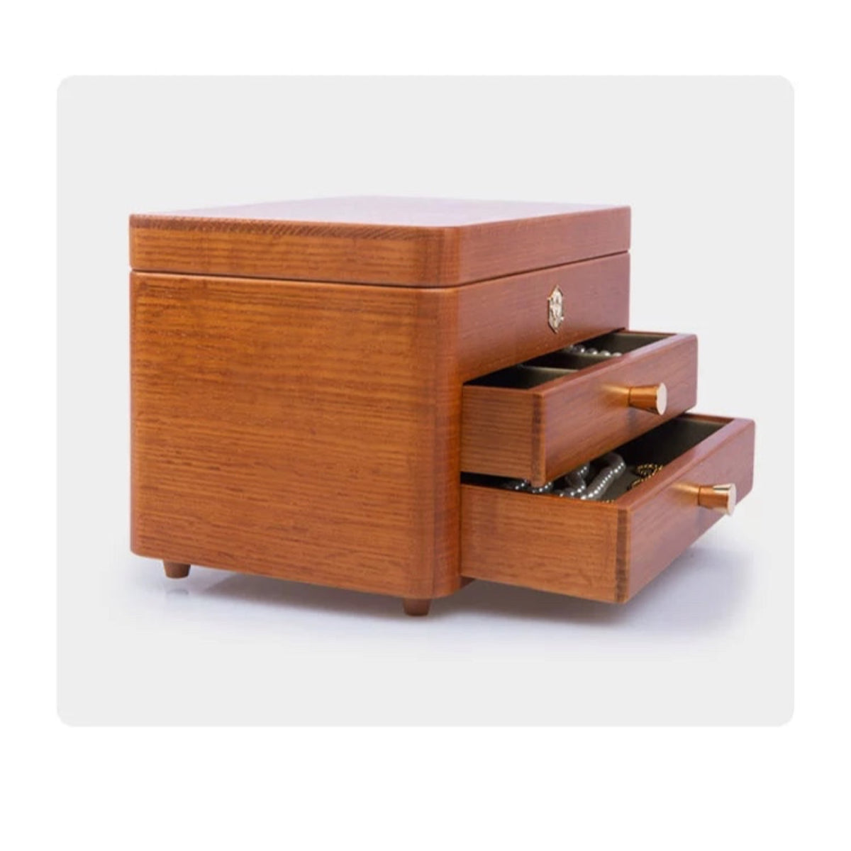 Side view of three-tier jewelry box with drawers open